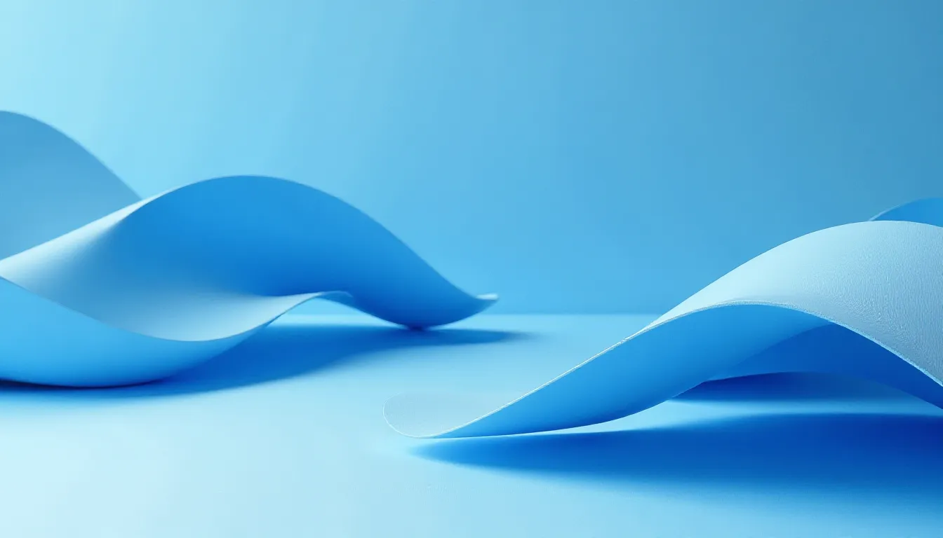 Dois pedaços de papel azul ondulado sobre um fundo azul claro, destacando formas fluidas e modernas, ideais para projetos de design gráfico e estética visual.